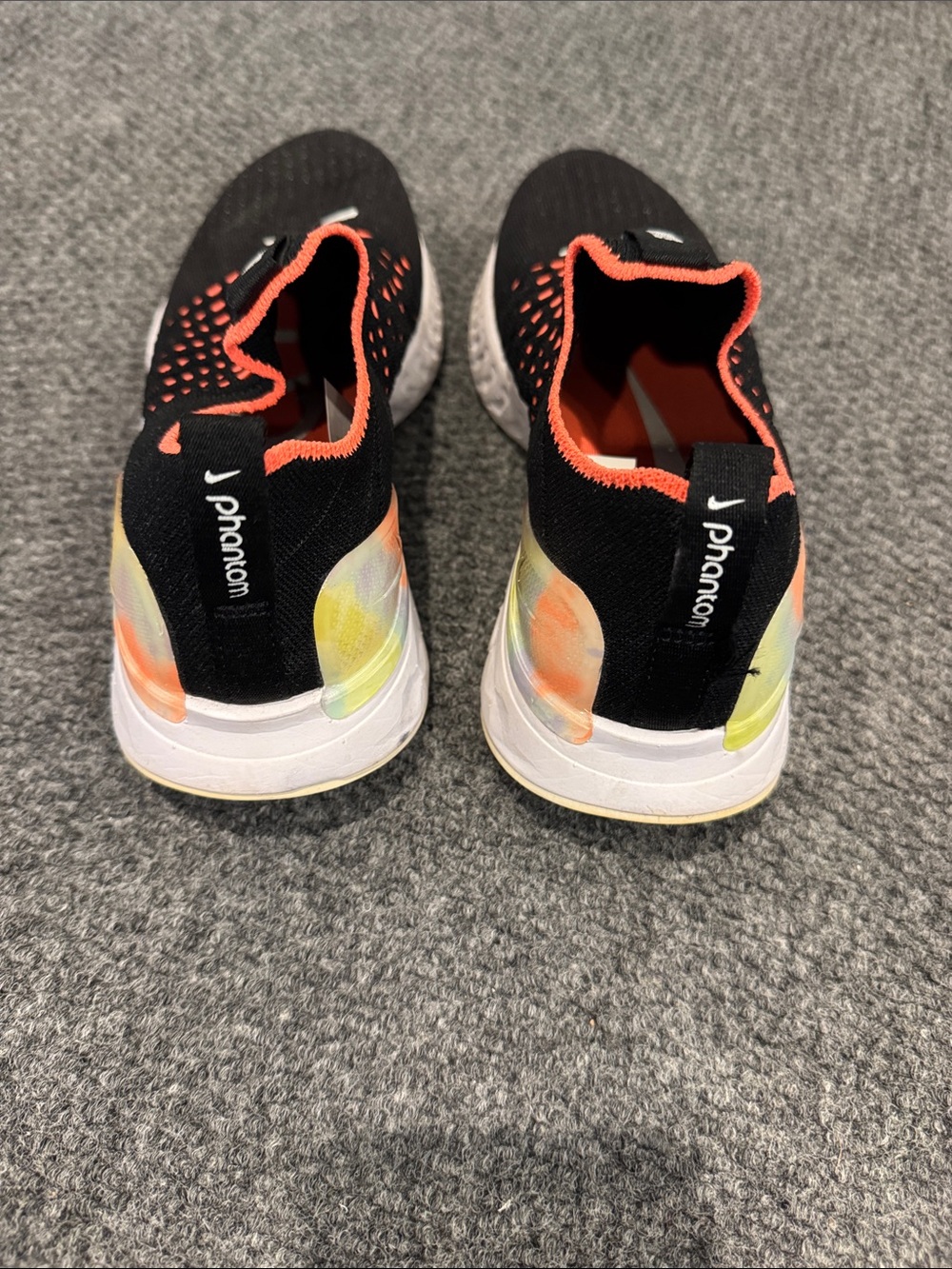 Nike Phantom Women's Black Slip-On Sneakers with Orange and Yellow Accents